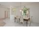 Bright dining area featuring tiled flooring and a hanging light fixture at 1156 Ridgegrove W Dr, Palm Harbor, FL 34683