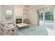 Inviting living room with fireplace, ceiling fan, and sliding glass doors to the pool at 1156 Ridgegrove W Dr, Palm Harbor, FL 34683