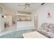 Open concept living area with view of the kitchen and dining area, lots of natural light at 1156 Ridgegrove W Dr, Palm Harbor, FL 34683