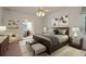 Tranquil main bedroom with a ceiling fan, neutral tones, and an ensuite bathroom with study nook at 1156 Ridgegrove W Dr, Palm Harbor, FL 34683