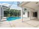 Spacious lanai and pool area offering a perfect spot for outdoor entertaining and relaxation at 1156 Ridgegrove W Dr, Palm Harbor, FL 34683