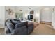 Comfortable living room with a plush sofa, large windows, and access to an outdoor balcony at 1201 High Hammock Dr # 302, Tampa, FL 33619