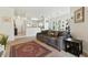 Inviting living room with plush sofa, neutral walls, and an open layout leading to the kitchen at 1201 High Hammock Dr # 302, Tampa, FL 33619