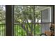 Relaxing porch with a serene view of lush greenery and mature trees at 1201 High Hammock Dr # 302, Tampa, FL 33619