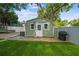 Outdoor shed on a well-maintained lawn and stone patio at 1208 E Crenshaw St, Tampa, FL 33604