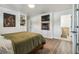 Cozy bedroom with built-in storage, a television, and a fireplace, perfect for relaxing and unwinding at 1208 E Crenshaw St, Tampa, FL 33604