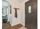 Elegant front entryway featuring a modern door, arched doorway and dark wood floors at 1208 E Crenshaw St, Tampa, FL 33604