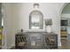 Charming entryway featuring a stylish console table and arched doorway to the living space at 1208 E Crenshaw St, Tampa, FL 33604