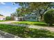 Charming single-story home showcasing manicured lawn and sidewalk at 1208 E Crenshaw St, Tampa, FL 33604