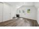 Spacious interior of outdoor shed features wood flooring and natural light at 1208 E Crenshaw St, Tampa, FL 33604