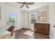 Bright office features a wooden desk, natural light, and wood flooring at 1208 E Crenshaw St, Tampa, FL 33604