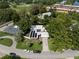 Aerial view of a stylish home showcasing solar panels, lush landscaping, and a convenient location at 1309 Eastfield Dr, Clearwater, FL 33764