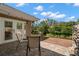 Relaxing backyard with a wooden deck, stone fire pit and waterfront view at 1309 Eastfield Dr, Clearwater, FL 33764
