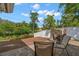 Relaxing backyard with a wooden deck, stone fire pit and waterfront view at 1309 Eastfield Dr, Clearwater, FL 33764