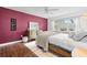 Bright bedroom featuring hardwood floors, a large window, and neutral walls at 1309 Eastfield Dr, Clearwater, FL 33764