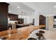 A stunning kitchen that features a custom island countertop, stainless steel appliances and dark wood cabinets at 1309 Eastfield Dr, Clearwater, FL 33764
