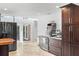 Bright kitchen features stainless steel appliances, custom cabinets, and large island with seating at 1309 Eastfield Dr, Clearwater, FL 33764