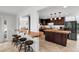 An open kitchen with custom wood countertop, an island and a view of the dining and living area at 1309 Eastfield Dr, Clearwater, FL 33764