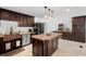 Spacious kitchen features stainless steel appliances, custom cabinets, and large island at 1309 Eastfield Dr, Clearwater, FL 33764