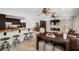 A large living room connected to the kitchen with a beautiful brick fireplace and a large sectional sofa at 1309 Eastfield Dr, Clearwater, FL 33764