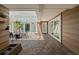 Enclosed, screened in patio with tile flooring, an outdoor dining set, and lots of natural light at 1309 Eastfield Dr, Clearwater, FL 33764