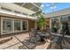 A spacious screened-in patio with tile flooring and an outdoor dining set, perfect for outdoor entertaining at 1309 Eastfield Dr, Clearwater, FL 33764