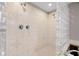 Modern bathroom shower featuring glass blocks, tile walls, and a double shower head at 1309 Eastfield Dr, Clearwater, FL 33764