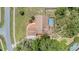 Aerial view of single-story home featuring backyard pool and well-kept lawn at 13167 Roseanna Dr, Spring Hill, FL 34609