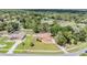 Aerial view of a home nestled amongst mature trees in a quiet residential neighborhood at 13167 Roseanna Dr, Spring Hill, FL 34609