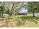 A backyard featuring mature trees that adds privacy to the pool area at 13167 Roseanna Dr, Spring Hill, FL 34609