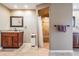 Bathroom showcasing dual vanities, tiled floors, a walk-in shower with glass door, and neutral tones at 13167 Roseanna Dr, Spring Hill, FL 34609