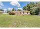 A well-maintained home with a manicured lawn showcasing the home's exterior at 13167 Roseanna Dr, Spring Hill, FL 34609
