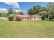 A well-maintained home with a manicured lawn and beautiful landscaping enhancing curb appeal at 13167 Roseanna Dr, Spring Hill, FL 34609