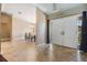 Welcoming foyer with tile flooring leading into the dining room, creating an open and airy feel at 13167 Roseanna Dr, Spring Hill, FL 34609