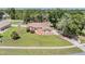 Well-maintained yard with mature trees and landscaping showcasing this lovely single-story home at 13167 Roseanna Dr, Spring Hill, FL 34609
