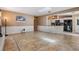 Open-concept space seamlessly connects the living room, kitchen, and dining area for easy entertaining at 13167 Roseanna Dr, Spring Hill, FL 34609