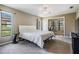 Serene main bedroom with carpet flooring, a ceiling fan, and a separate sitting area that can be used as an office at 13167 Roseanna Dr, Spring Hill, FL 34609