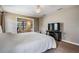 Calm main bedroom with carpet flooring, a ceiling fan, and a separate sitting area at 13167 Roseanna Dr, Spring Hill, FL 34609