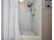 Clean shower stall with white tile, modern shower head, and a built-in soap dish at 13167 Roseanna Dr, Spring Hill, FL 34609