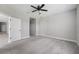 A spacious bedroom with neutral paint and soft carpeting throughout at 13524 Circa Crossing Dr, Lithia, FL 33547