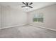 Bedroom features neutral walls, gray carpet, a ceiling fan and one window at 13524 Circa Crossing Dr, Lithia, FL 33547