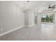 Dining room with modern chandelier lighting, neutral walls, and tile flooring at 13524 Circa Crossing Dr, Lithia, FL 33547