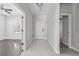 Inviting entryway with tile flooring and direct access to multiple rooms with beautiful dark wood floors at 13524 Circa Crossing Dr, Lithia, FL 33547