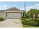 Charming single-story home featuring an attached two-car garage at 13524 Circa Crossing Dr, Lithia, FL 33547