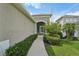 Inviting front entrance with a paved walkway and well-maintained landscaping at 13524 Circa Crossing Dr, Lithia, FL 33547