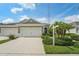 Charming home with a two-car garage, landscaped front yard, and inviting curb appeal at 13524 Circa Crossing Dr, Lithia, FL 33547