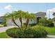 Well-manicured front yard with palm trees and lush landscaping enhances curb appeal of this lovely single-Gathering home at 13524 Circa Crossing Dr, Lithia, FL 33547