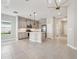 Open-concept kitchen with stainless steel appliances and central island at 13524 Circa Crossing Dr, Lithia, FL 33547