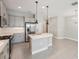 Bright kitchen with stainless steel appliances and a functional island at 13524 Circa Crossing Dr, Lithia, FL 33547