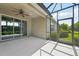 Covered lanai featuring a ceiling fan and sliding glass door entry into the home at 13524 Circa Crossing Dr, Lithia, FL 33547